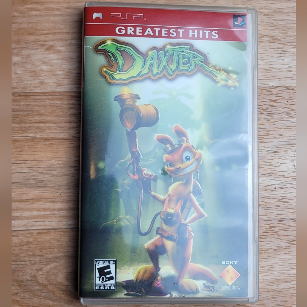 Sony Daxter Greatest Hits - PlayStation Portable Game with Green and Red Cover